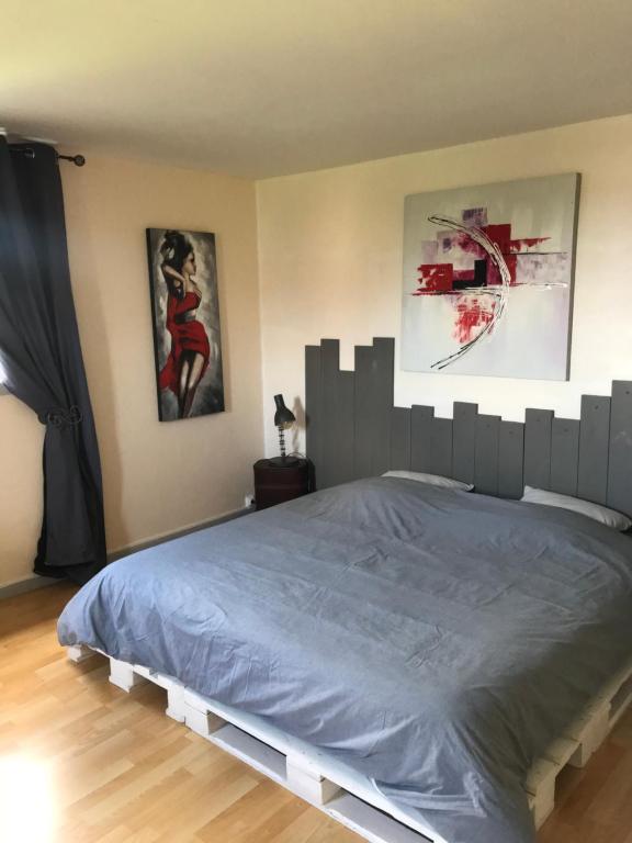Postel nebo postele na pokoji v ubytování Chambre d'hôtes "COQUELICOT"