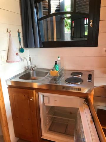 a bathroom with a sink and a mirror at Lou Bohème in Le Briou