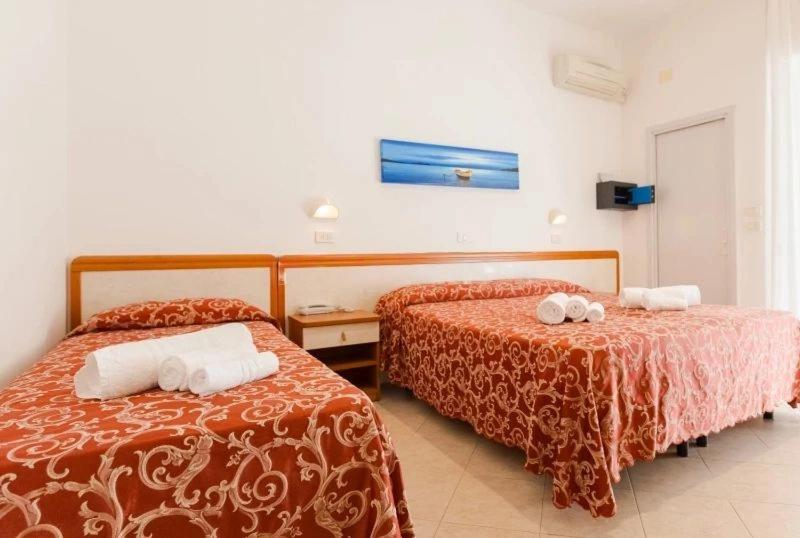 Postel nebo postele na pokoji v ubytování Hotel Ivana