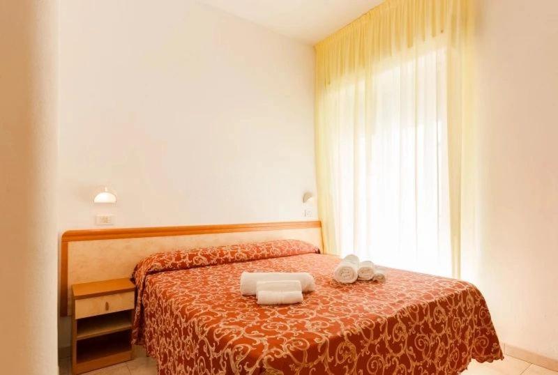 Postel nebo postele na pokoji v ubytování Hotel Ivana