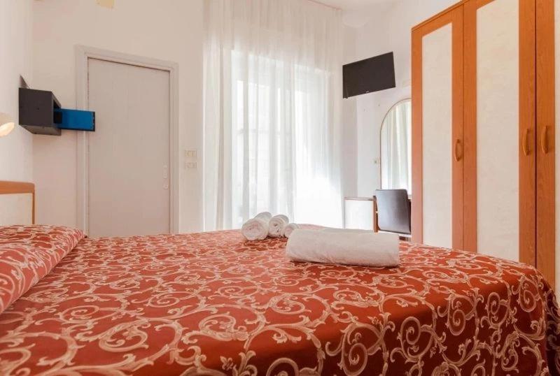 Postel nebo postele na pokoji v ubytování Hotel Ivana