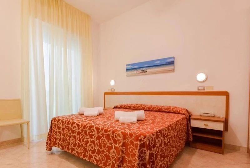 Postel nebo postele na pokoji v ubytování Hotel Ivana