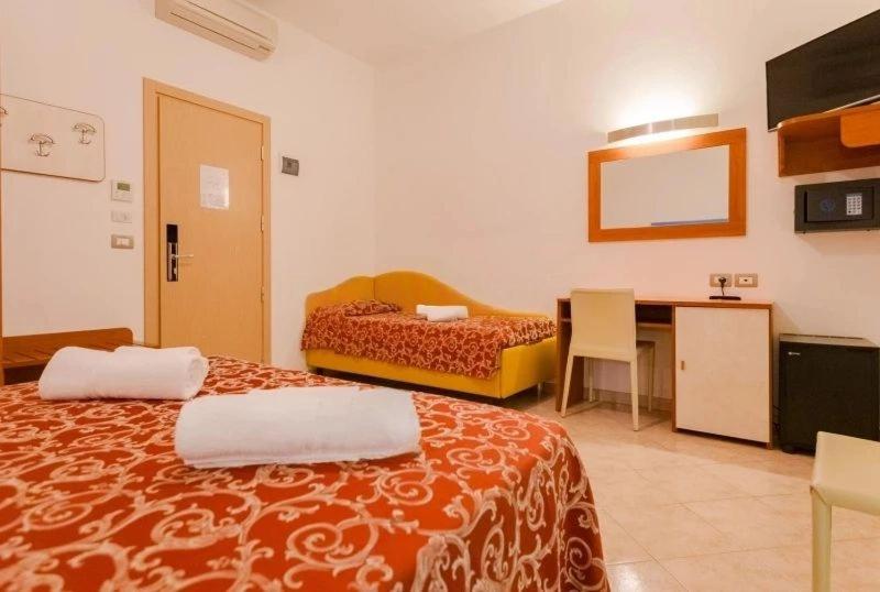 Postel nebo postele na pokoji v ubytování Hotel Ivana