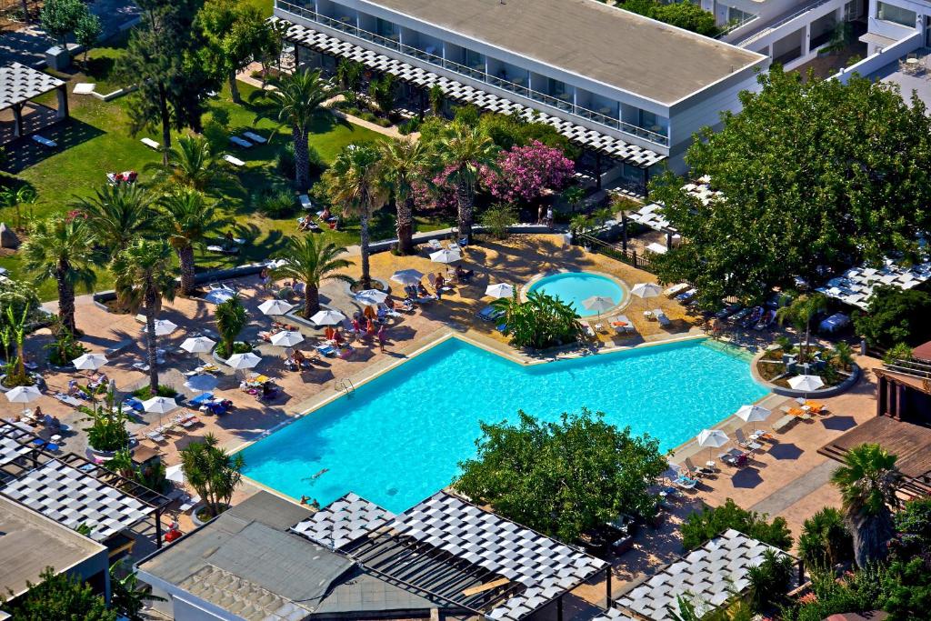 an overhead view of a swimming pool in a resort at Sun Palace Hotel Resort & Spa in Kos Town