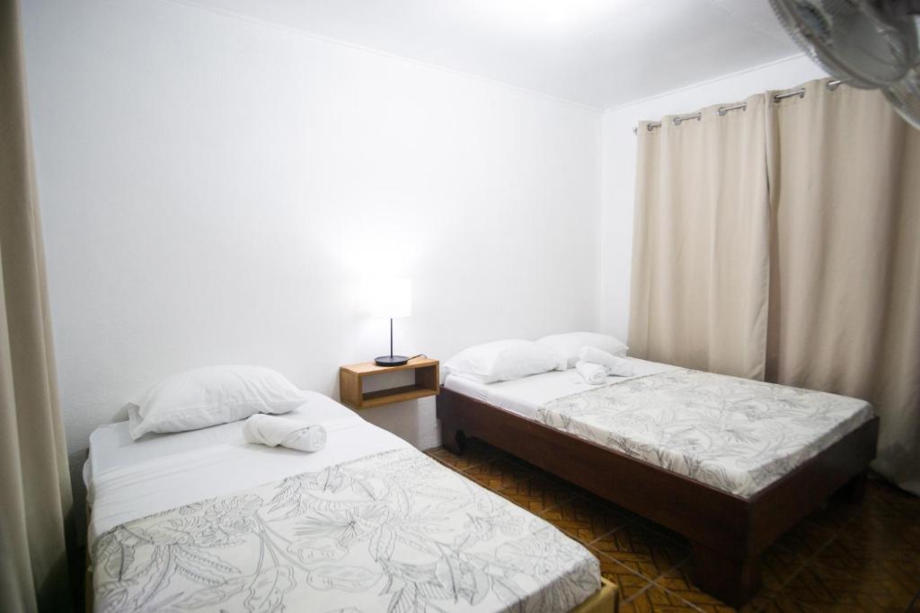 Postel nebo postele na pokoji v ubytování Pura Vibra Hostel