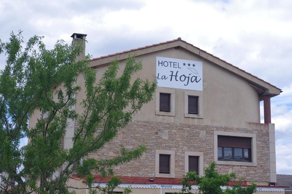a building with a sign that reads hotel khalifa at Hotel la Hoja*** in Aldeadávila de la Ribera