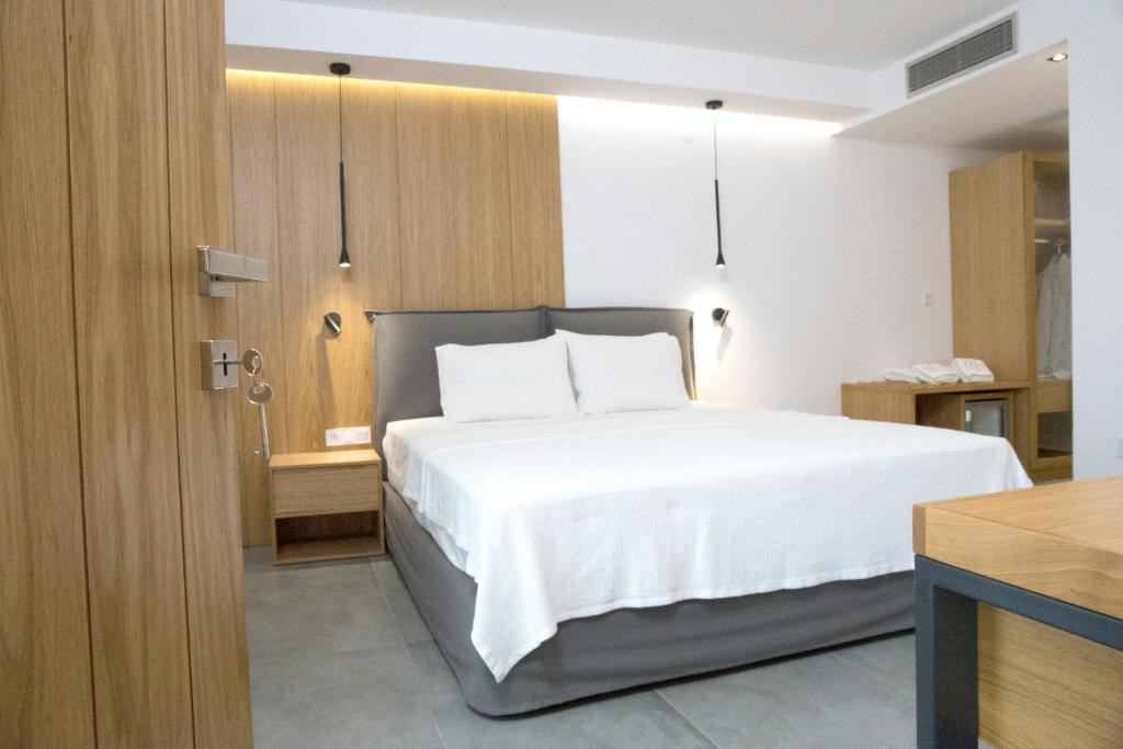 Postel nebo postele na pokoji v ubytování The Oak Hotel