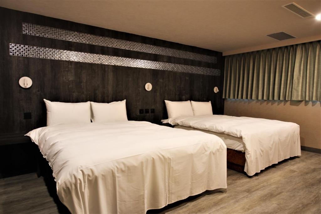 Postel nebo postele na pokoji v ubytování Golden Home Hotel