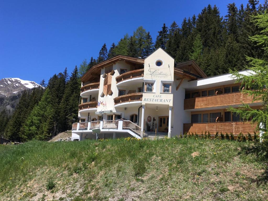 a building on the side of a hill at Landhaus Paradies Samnaun Spiss in Spiss