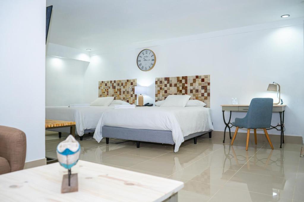 Postel nebo postele na pokoji v ubytování Hotel Zima