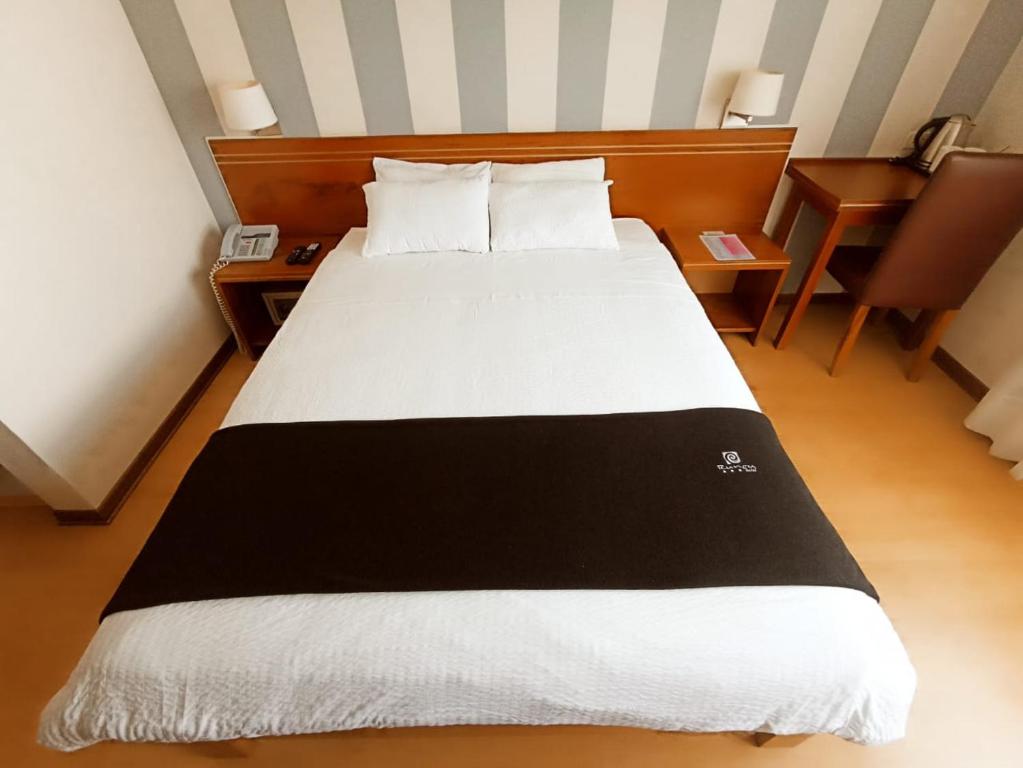 Ένα ή περισσότερα κρεβάτια σε δωμάτιο στο Hotel Boutique Runcu Miraflores