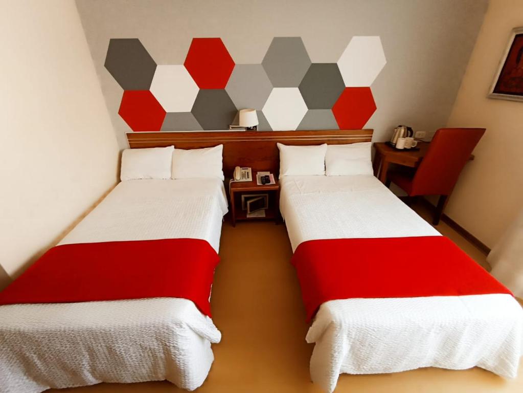 Ένα ή περισσότερα κρεβάτια σε δωμάτιο στο Hotel Boutique Runcu Miraflores