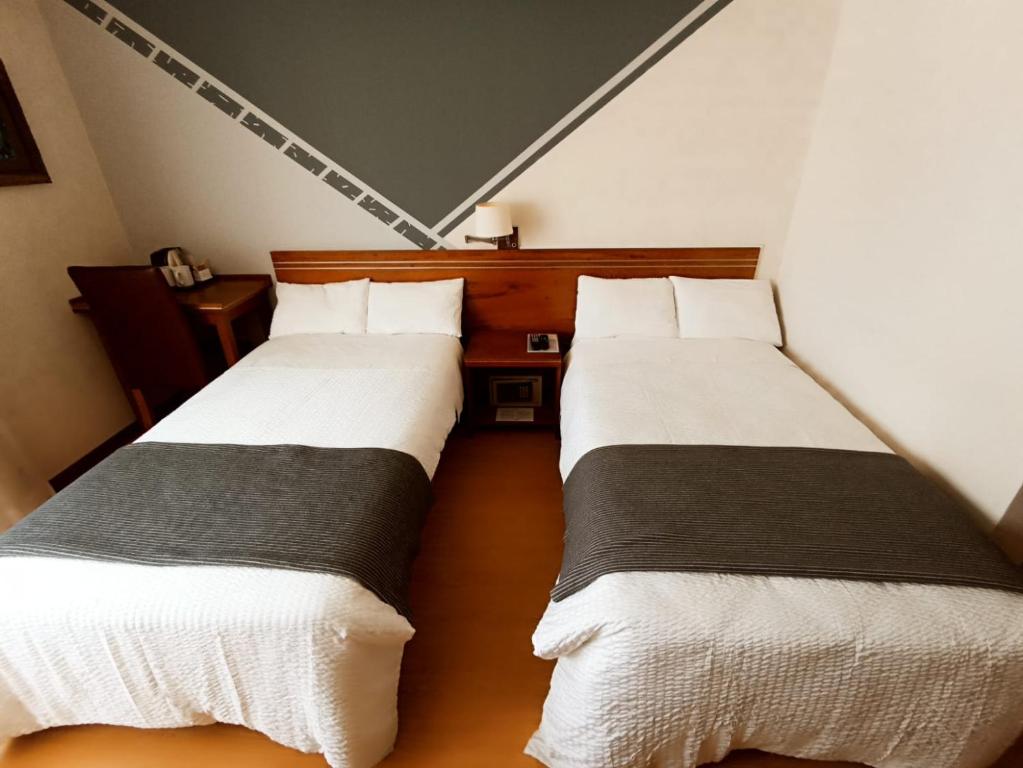 Ένα ή περισσότερα κρεβάτια σε δωμάτιο στο Hotel Boutique Runcu Miraflores