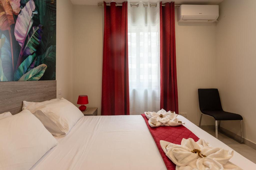 Postel nebo postele na pokoji v ubytování Red Rose