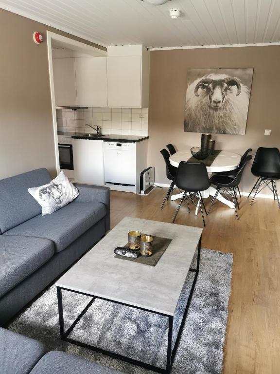 a living room with a couch and a table at Bøvervegen 19 Appartment nr 9 in Bjorli