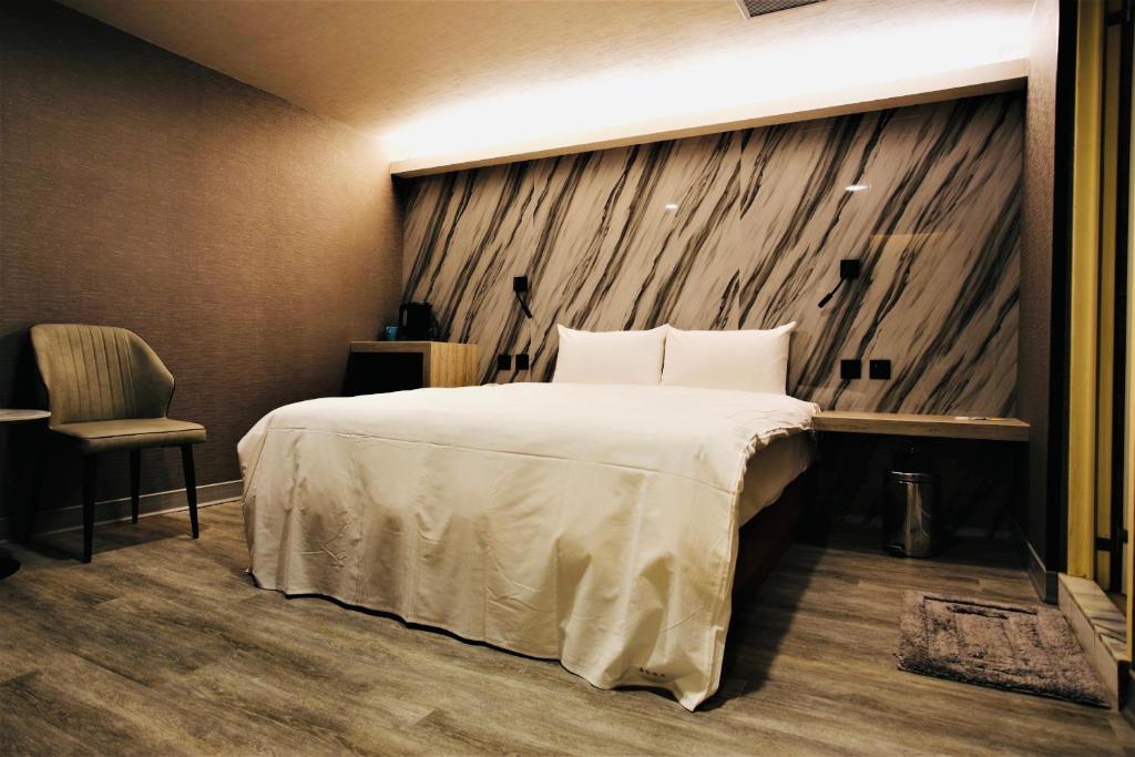 Postel nebo postele na pokoji v ubytování Golden Home Hotel