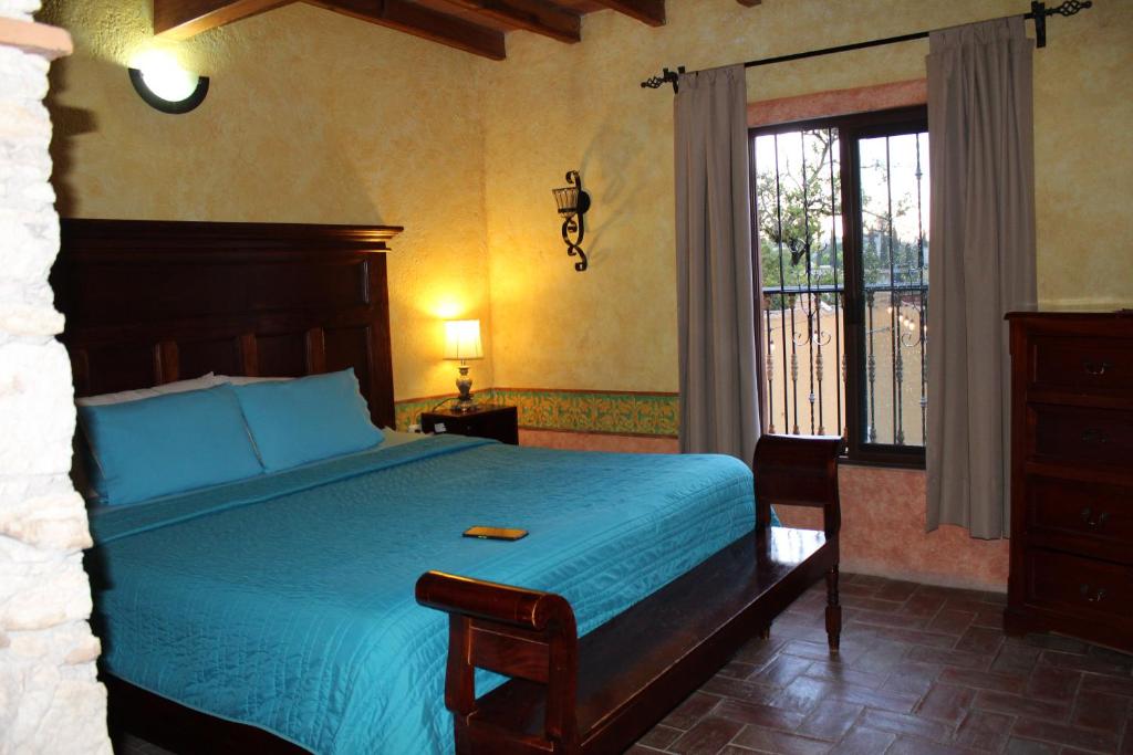 Postel nebo postele na pokoji v ubytování Hotel Casa Caro
