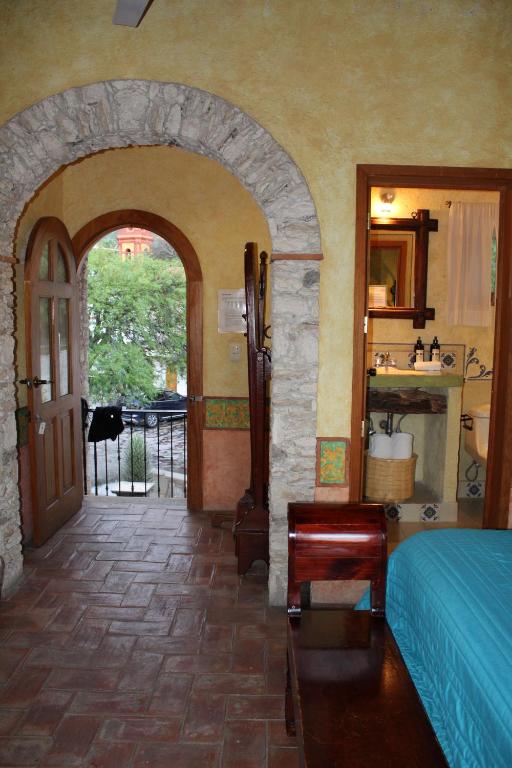 Postel nebo postele na pokoji v ubytování Hotel Casa Caro