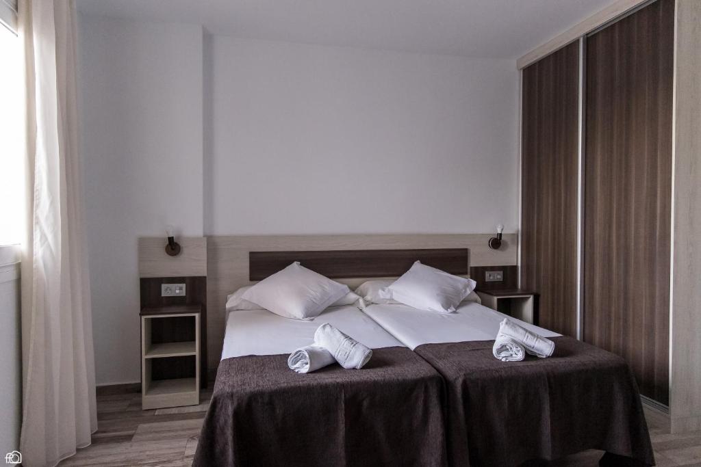 Postel nebo postele na pokoji v ubytování Mesón Hostal La Cabaña