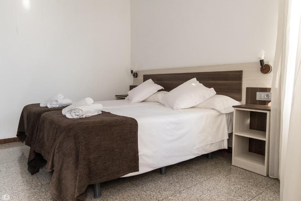 Postel nebo postele na pokoji v ubytování Mesón Hostal La Cabaña