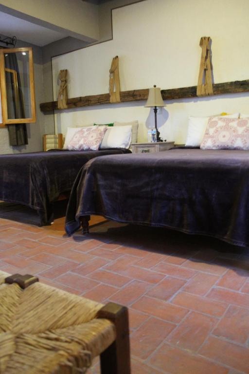 Postel nebo postele na pokoji v ubytování Hotel Casa Caro