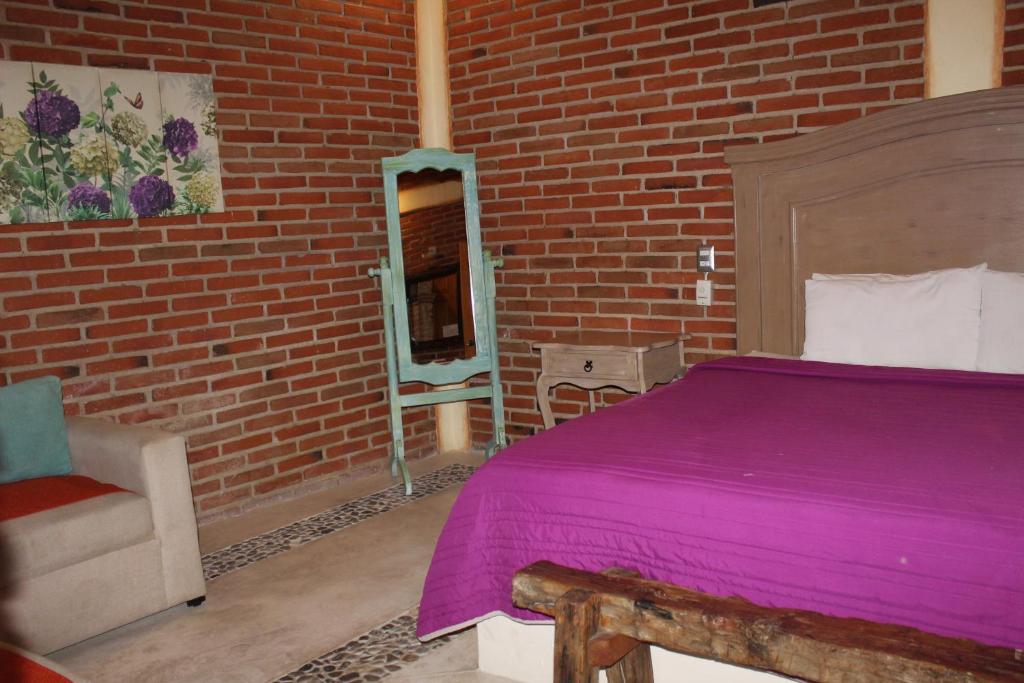 Postel nebo postele na pokoji v ubytování Hotel Casa Caro