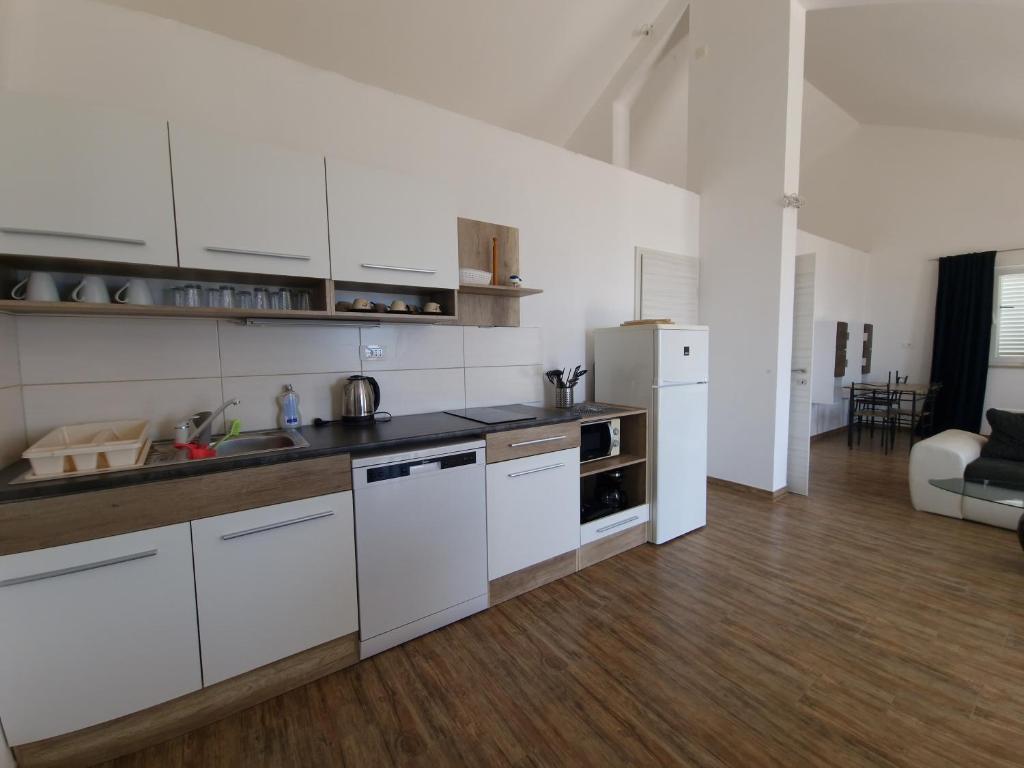 Kuchyň nebo kuchyňský kout v ubytování Apartmani Zen