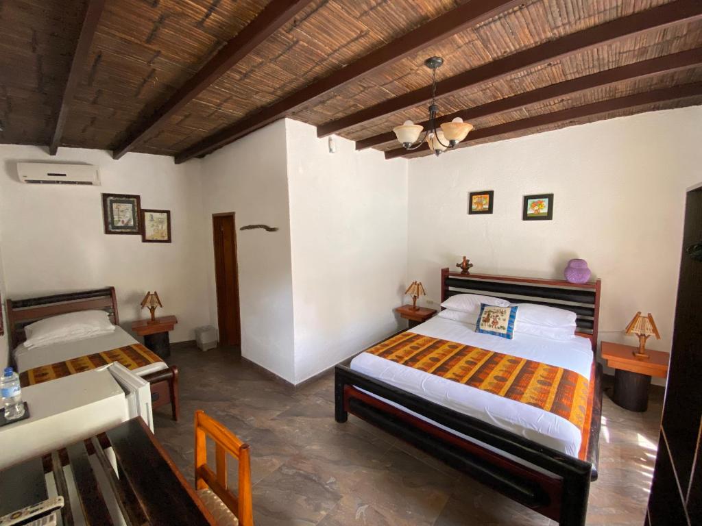 Postel nebo postele na pokoji v ubytování Hotel Puerto Gaviota
