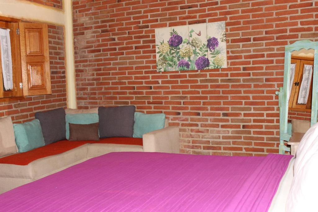 Postel nebo postele na pokoji v ubytování Hotel Casa Caro