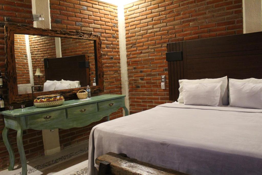 Postel nebo postele na pokoji v ubytování Hotel Casa Caro
