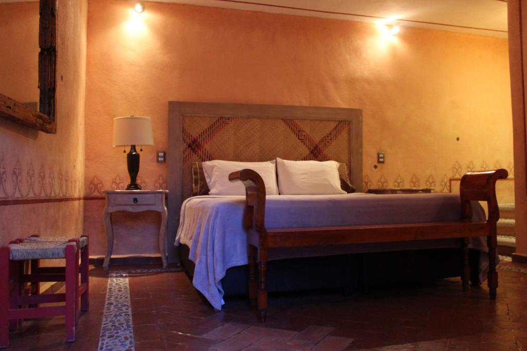 Postel nebo postele na pokoji v ubytování Hotel Casa Caro