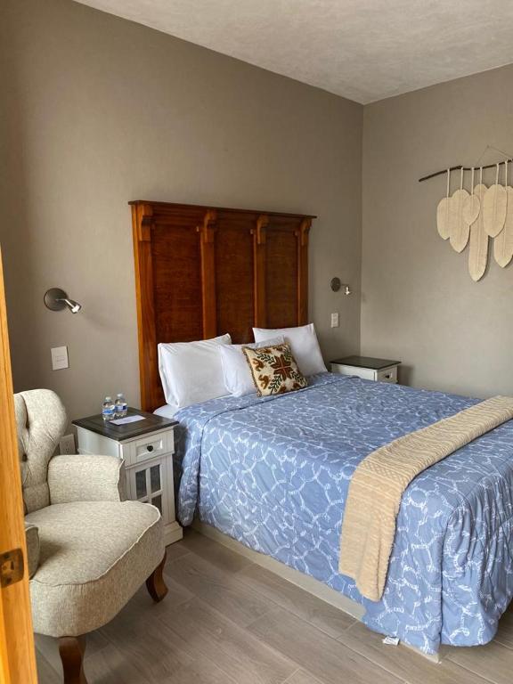 Postel nebo postele na pokoji v ubytování Hotel Casa Caro