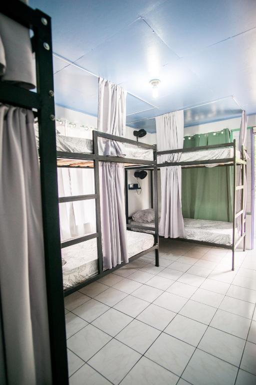 Postel nebo postele na pokoji v ubytování Pura Vibra Hostel