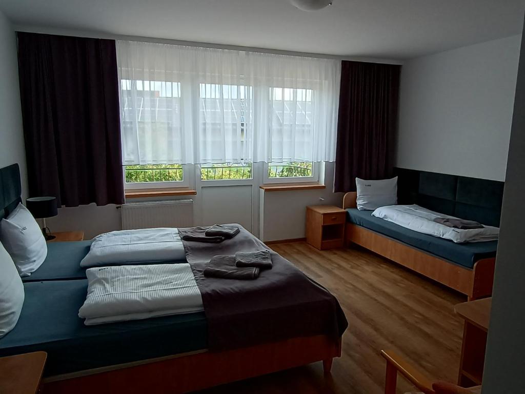 Postel nebo postele na pokoji v ubytování Dom Wczasowy Larix
