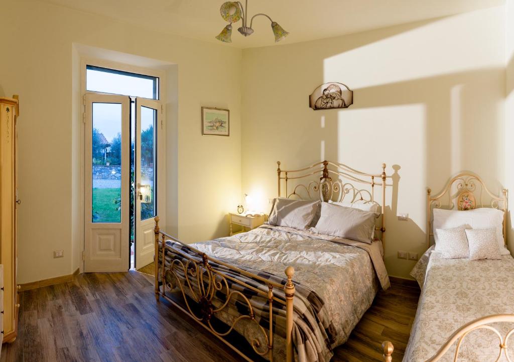 Postel nebo postele na pokoji v ubytování Agriturismo Casa Rosa