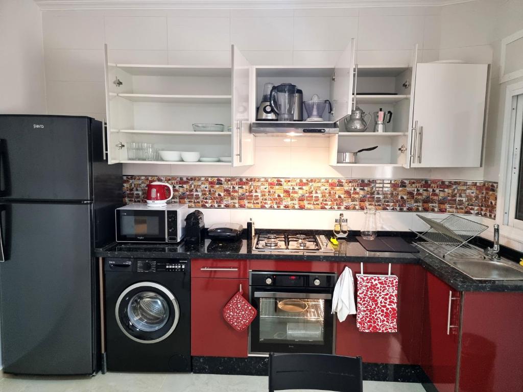 Kuchyň nebo kuchyňský kout v ubytování Prestige Apartment Oued Laou
