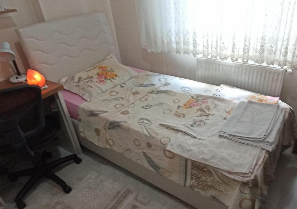 Postel nebo postele na pokoji v ubytování SOYLU Suites