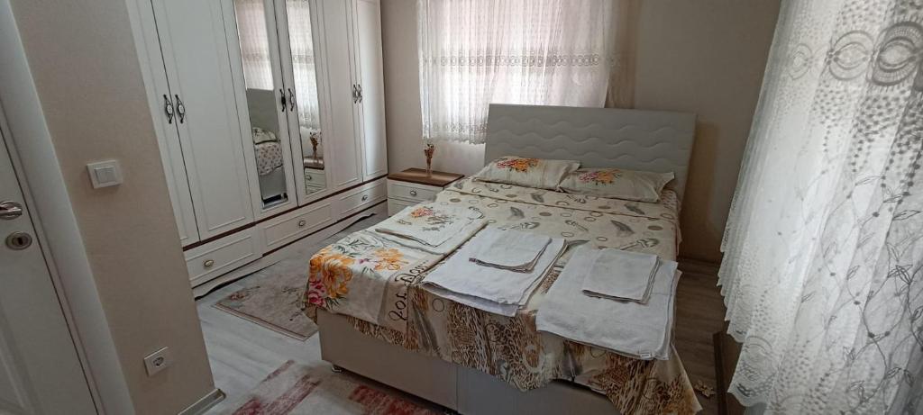 Postel nebo postele na pokoji v ubytování SOYLU Suites