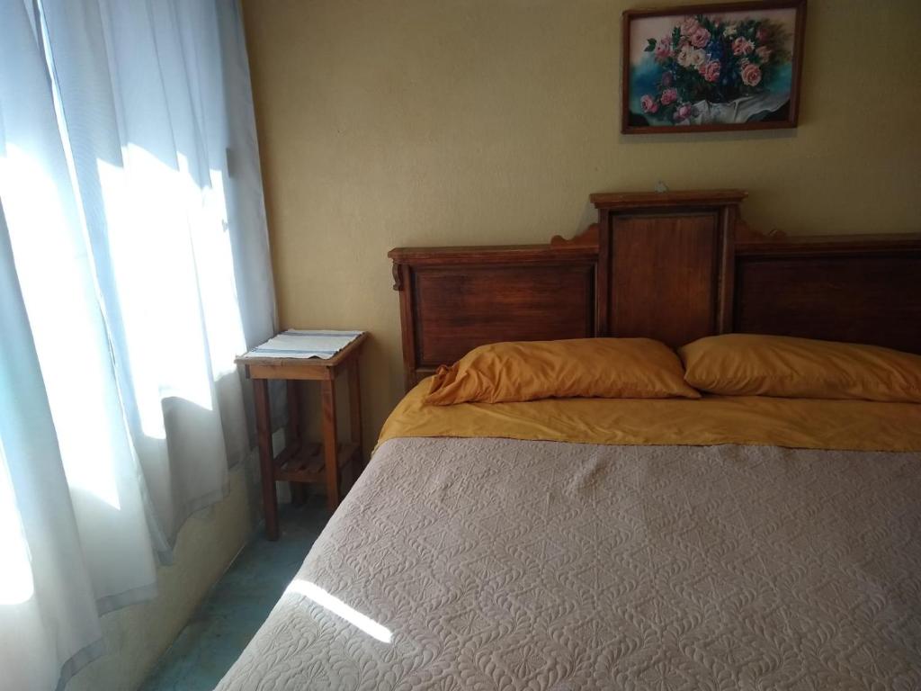 Postel nebo postele na pokoji v ubytování Posada Lindavista