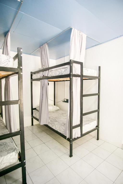 Postel nebo postele na pokoji v ubytování Pura Vibra Hostel