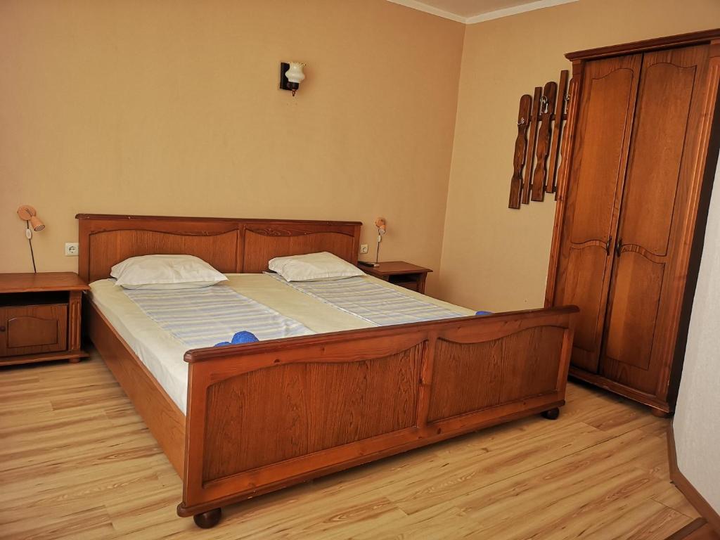 A bed or beds in a room at Paunovi Guest House
