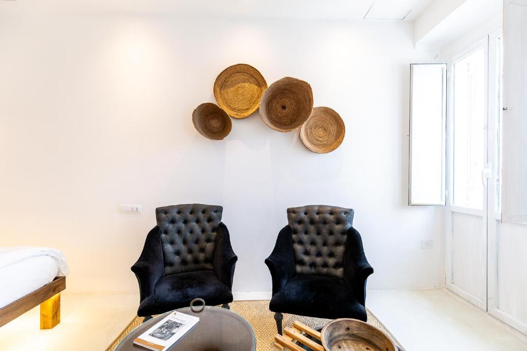 Area soggiorno di Crobi Museum and Suites
