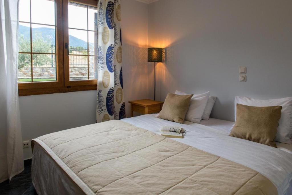 Postel nebo postele na pokoji v ubytování Olympus Pantheon Luxury Villas