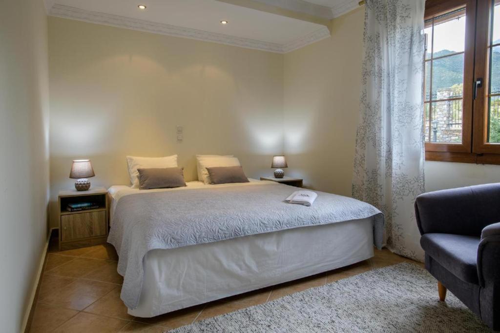 Postel nebo postele na pokoji v ubytování Olympus Pantheon Luxury Villas