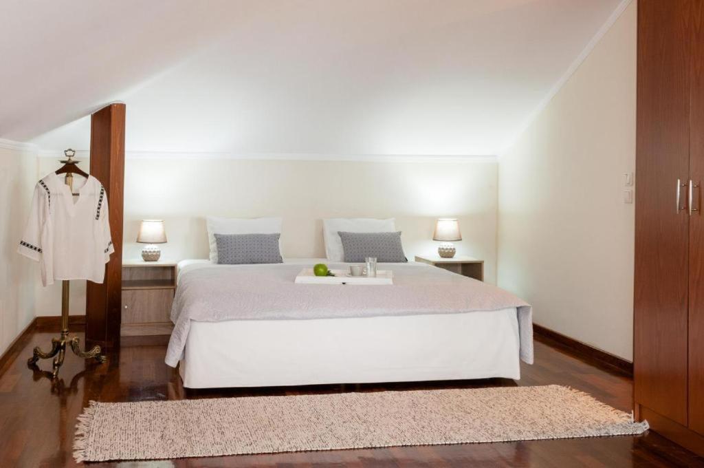 Postel nebo postele na pokoji v ubytování Olympus Pantheon Luxury Villas