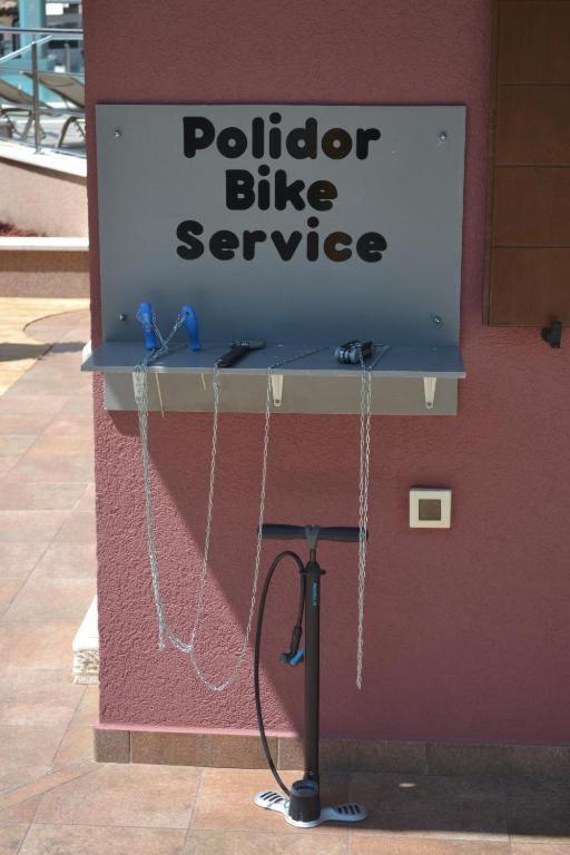 a sign for a public bike service on a wall at Polidor Glamping Resort in Poreč