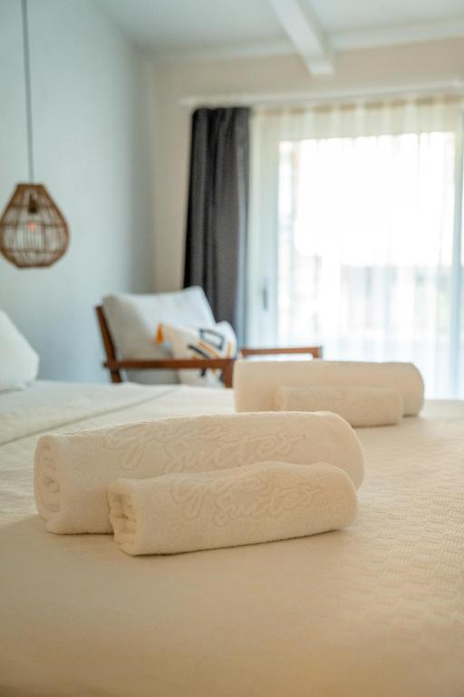 Postel nebo postele na pokoji v ubytování Gizz Suites