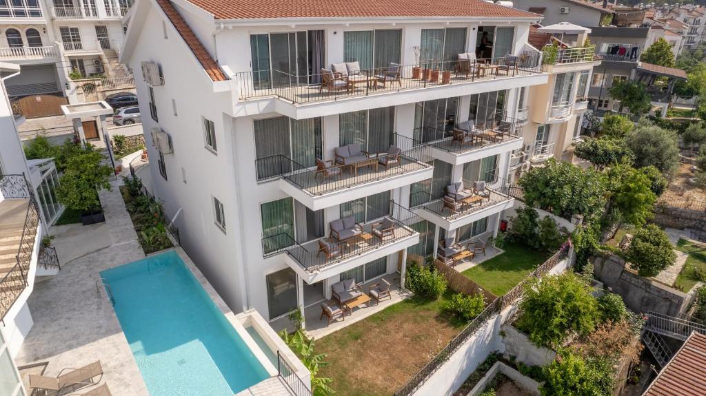 an aerial view of a large white building with a yard at Gizz Suites in Fethiye