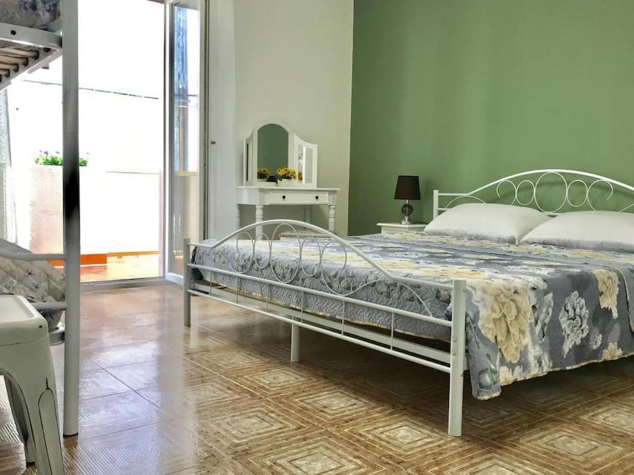 Postel nebo postele na pokoji v ubytování Casa Mariù