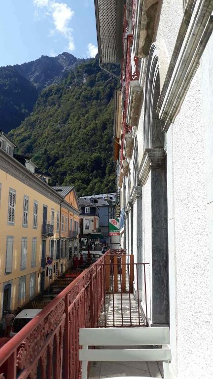 a balcony of a building with a view of a mountain at Bel appt 3 * plein Centre ville 4 pers. + balcon in Cauterets